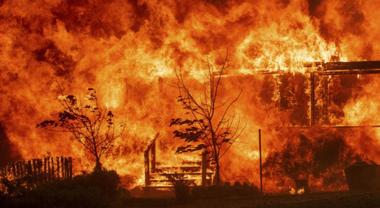 Flames consume a home as the River Fire tears though Lakeport, Calif., on Tuesday, July 31, 2018. Flames consume a home as the River Fire tears though Lakeport, Calif., on Tuesday, July 31, 2018.