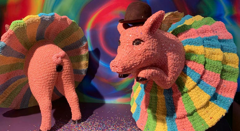 A candy sculpture of ballerina pigs. A candy sculpture of ballerina pigs.