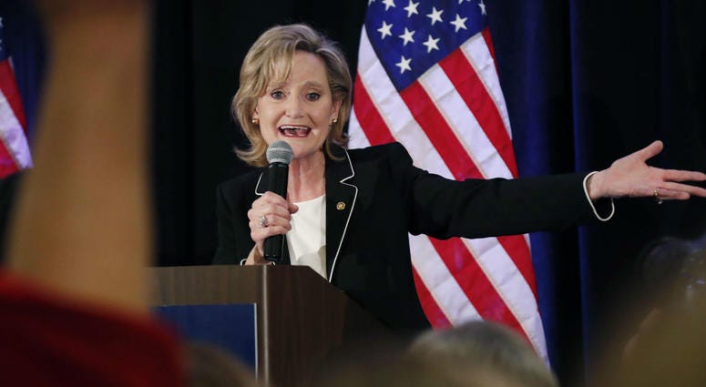 Republican U.S. Sen. Cindy Hyde-Smith calls on her family members to identify themselves as she celebrates her runoff win over Democrat Mike Espy in Jackson, Miss., Tuesday, Nov. 27, 2018. Republican U.S. Sen. Cindy Hyde-Smith calls on her family members to identify themselves as she celebrates her runoff win over Democrat Mike Espy in Jackson, Miss., Tuesday, Nov. 27, 2018.