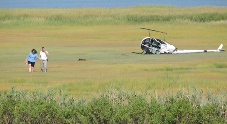 A crashed helicopter lies in the marsh grass near the Ocean City airport at 28th Street. A crashed helicopter lies in the marsh grass near the Ocean City airport at 28th Street.