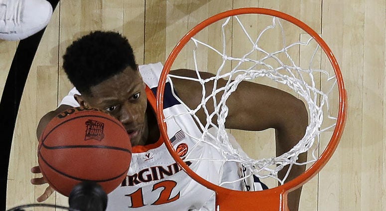 Virginia's De'Andre Hunter (12) goes up for a basket during the first half in the championship of the Final Four NCAA college basketball tournament against Texas Tech, Monday, April 8, 2019, in Minneapolis. Virginia's De'Andre Hunter (12) goes up for a basket during the first half in the championship of the Final Four NCAA college basketball tournament against Texas Tech, Monday, April 8, 2019, in Minneapolis.