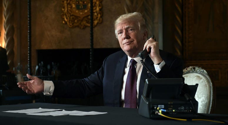 President Donald Trump asks if reporters can hear the audio as he talks with troops via teleconference from his Mar-a-Lago estate in Palm Beach, Fla., Thursday, Nov. 22, 2018. President Donald Trump asks if reporters can hear the audio as he talks with troops via teleconference from his Mar-a-Lago estate in Palm Beach, Fla., Thursday, Nov. 22, 2018.