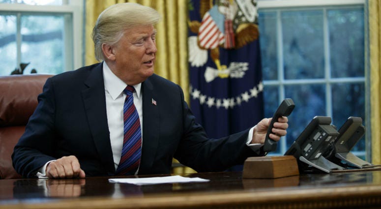 President Donald Trump hangs up after talking with Mexican President Enrique Pena Nieto on the phone in the Oval Office of the White House, Monday, Aug. 27, 2018, in Washington. President Donald Trump hangs up after talking with Mexican President Enrique Pena Nieto on the phone in the Oval Office of the White House, Monday, Aug. 27, 2018, in Washington.