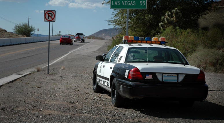 A Nevada cop car on the side of the road outside of Las Vegas watching for speeders. Police Speed Trap