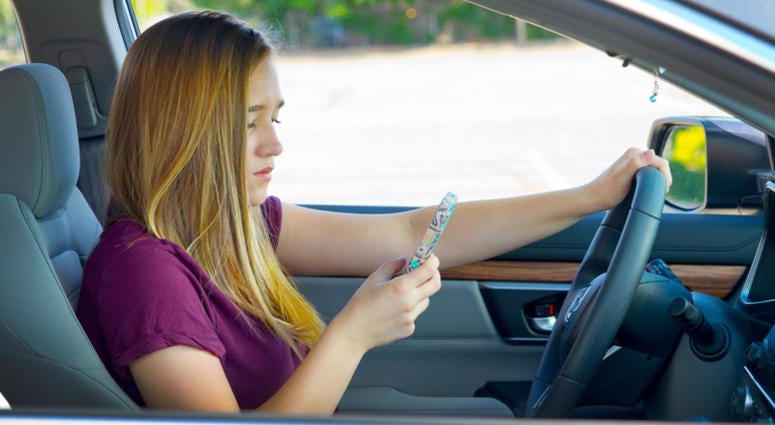 Teen girl texting while driving Teen Driving