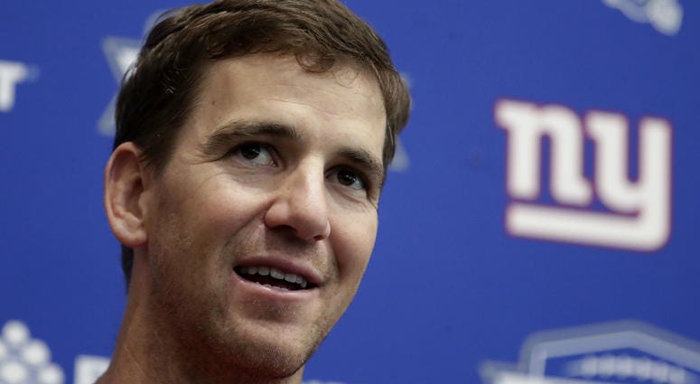 In an April 25, 2018 file photo, New York Giants quarterback Eli Manning speaks to reporters during NFL football training camp, in East Rutherford, N.J. New York Giants quarterback Eli Manning