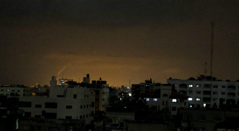 Smoke rises following an Israeli strikes on Gaza City, early Wednesday, May 30, 2018. Smoke rises following an Israeli strikes on Gaza City