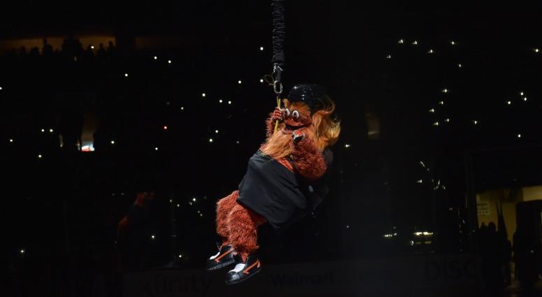 Philadelphia Flyers mascot Gritty is lowered from the rafters before the first period of a game between the Flyers and the New York Rangers at the Wells Fargo Center on Nov. 23, 2018. Gritty