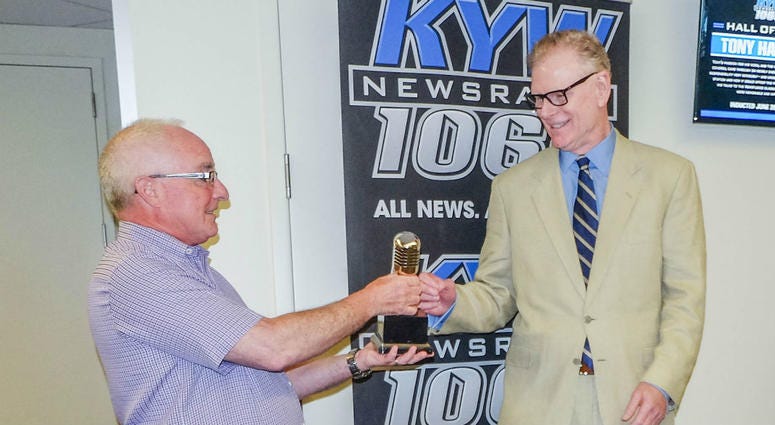 Steve Butler, director of news and programming at KYW Newsradio, presents retired reporter Tony Hanson with his Hall of Fame award. Steve Butler, director of news and programming at KYW Newsradio, presents retired reporter Tony Hanson with his Hall of Fame award.