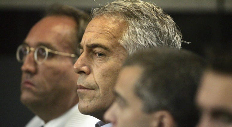 In this July 30, 2008, file photo, Jeffrey Epstein, center, appears in court in West Palm Beach, Fla. In this July 30, 2008, file photo, Jeffrey Epstein, center, appears in court in West Palm Beach, Fla.
