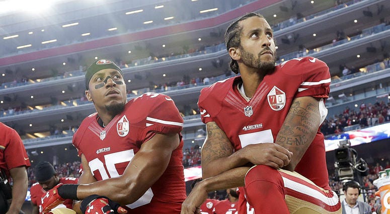 In this Monday, Sept. 12, 2016, file photo, San Francisco 49ers safety Eric Reid (35) and quarterback Colin Kaepernick (7) kneel during the national anthem before an NFL football game against the Los Angeles Rams in Santa Clara, Calif. San Francisco 49ers safety Eric Reid (35) and quarterback Colin Kaepernick (7)