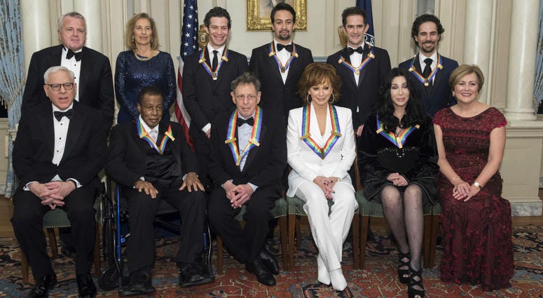 Front row from left: David Rubenstein, Wayne Shorter, Philip Glass, Reba McEntire, Cher, Deborah Rutter; back row from left: Deputy Secretary of State John Sullivan, Grace Rodriguez, Thomas Kail, Lin-Manuel Miranda, Andy Blankenbuehler, and Alex Lacamoire Front row from left: David Rubenstein, Wayne Shorter, Philip Glass, Reba McEntire, Cher, Deborah Rutter; back row from left: Deputy Secretary of State John Sullivan, Grace Rodriguez, Thomas Kail, Lin-Manuel Miranda, Andy Blankenbuehler, and Alex Lacamoire