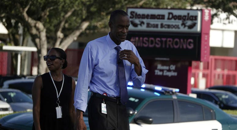 Broward County Superintendent of Schools Robert Runcie leaves Marjory Stoneman Douglas, Wednesday, Aug. 15, 2018, on the first day of school in Parkland, Fla. First day of school in Broward opens with heavy security presence