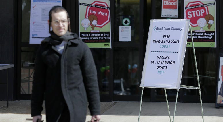 In this March 27, 2019 file photo, signs about measles and the measles vaccine are displayed at the Rockland County Health Department in Pomona, N.Y. In this March 27, 2019 file photo, signs about measles and the measles vaccine are displayed at the Rockland County Health Department in Pomona, N.Y.