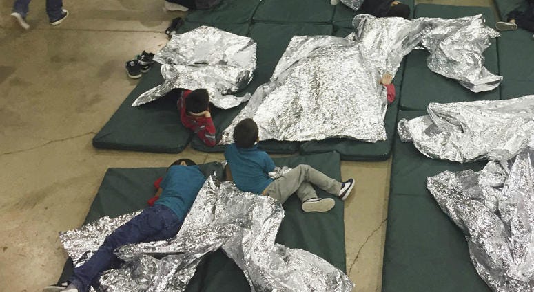 this June 17, 2018 file photo provided by U.S. Customs and Border Protection, people who've been taken into custody related to cases of illegal entry into the United States, rest in one of the cages at a facility in McAllen, Texas. this June 17, 2018 file photo provided by U.S. Customs and Border Protection, people who've been taken into custody related to cases of illegal entry into the United States, rest in one of the cages at a facility in McAllen, Texas.