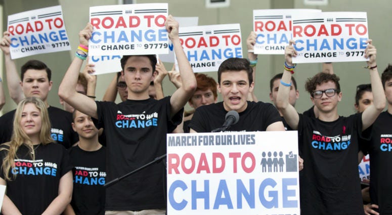 Cameron Kasky, center, speaks during a news conference, Monday, June 4, 2018, in Parkland, Fla. Parkland students, get out the vote