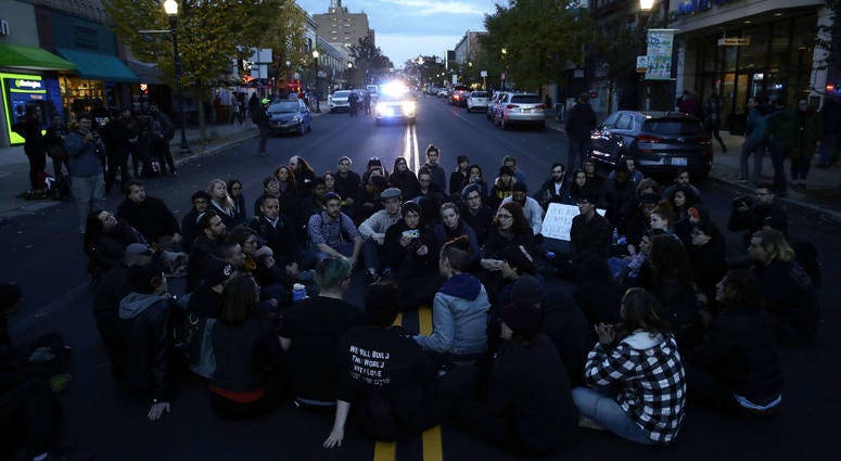 Protesters demonstrate on a main road in the Squirrel Hill neighborhood of Pittsburgh Tuesday, Oct. 30, 2018. Protesters demonstrate on a main road in the Squirrel Hill neighborhood of Pittsburgh Tuesday, Oct. 30, 2018.