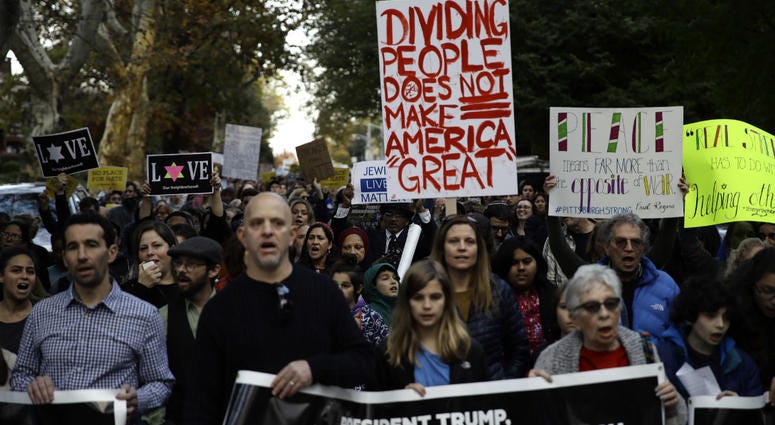 Protesters demonstrate near Pittsburgh's Tree of Life Synagogue where President Donald Trump and first lady Melania Trump were visiting a memorial in Pittsburgh, Tuesday, Oct. 30, 2018. Protesters demonstrate near Pittsburgh's Tree of Life Synagogue where President Donald Trump and first lady Melania Trump were visiting a memorial in Pittsburgh, Tuesday, Oct. 30, 2018.