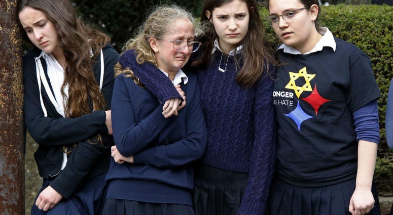 Students from the Yeshiva School in the Squirrel Hill neighborhood of Pittsburgh, pay their respects as the funeral procession for Dr. Jerry Rabinowitz passes their school en route to Homewood Cemetery. Students from the Yeshiva School in the Squirrel Hill neighborhood of Pittsburgh, pay their respects as the funeral procession for Dr. Jerry Rabinowitz passes their school en route to Homewood Cemetery.