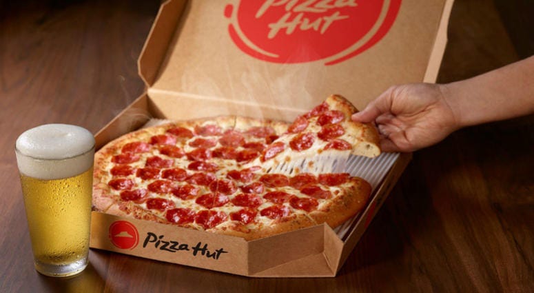Pizza Hut is leaning into its beer delivery service to get an edge over Domino's. Pizza Hut expands beer delivery service