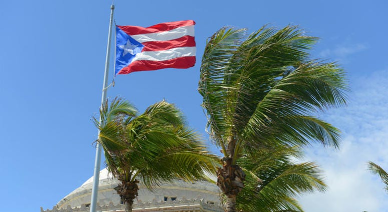 Flag of the Commonwealth of Puerto Rico in front of Capitolio, San Juan, Puerto Rico. Flag of the Commonwealth of Puerto Rico in front of Capitolio, San Juan, Puerto Rico.