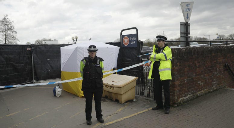 In this March 13, 2018, file photo, police officers guard a cordon around a police tent near the spot where former Russian spy Sergei Skripal and his daughter were found critically ill following exposure to the Russian-developed nerve agent Novichok. In this March 13, 2018, file photo, police officers guard a cordon around a police tent near the spot where former Russian spy Sergei Skripal and his daughter were found critically ill following exposure to the Russian-developed nerve agent Novichok.