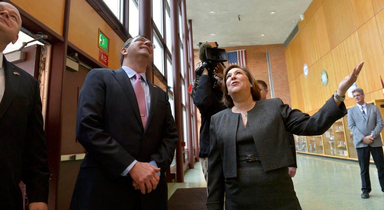 Superintendent of the Abington School District Amy Sichel gestures upward toward a group of students standing on a balcony as Secretary of Defense Ash Carter arrives at Abington Senior High School to visit his alma mater March 30, 2015. Superintendent of the Abington School District Amy Sichel gestures upward toward a group of students standing on a balcony as Secretary of Defense Ash Carter arrives at Abington Senior High School to visit his alma mater March 30, 2015.