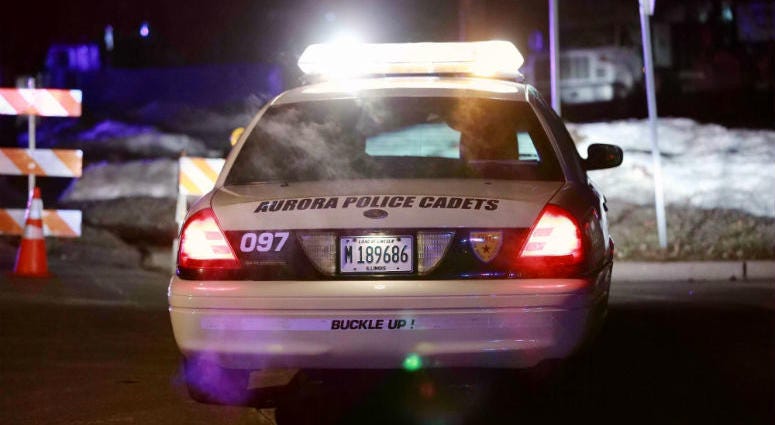 A police car is seen near the manufacturing plant where a mass shooting incident occurred in Aurora, the United States, on Feb. 15, 2019. Illinois Shooting