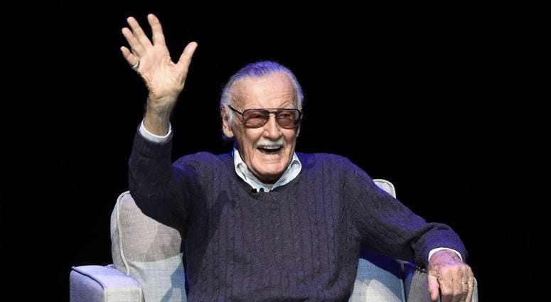 In this Aug. 22, 2017 file photo, comic book writer Stan Lee waves to the audience after being introduced onstage at the "Extraordinary: Stan Lee" tribute event at the Saban Theatre in Beverly Hills, Calif. In this Aug. 22, 2017 file photo, comic book writer Stan Lee waves to the audience after being introduced onstage at the "Extraordinary: Stan Lee" tribute event at the Saban Theatre in Beverly Hills, Calif.