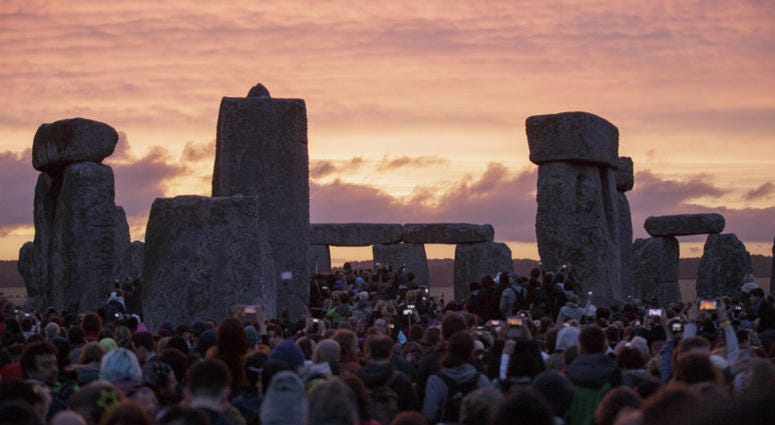 In this Sunday, June 21, 2015 file photo, the sun rises as thousands of revellers gather at the ancient stone circle Stonehenge to celebrate the Summer Solstice, near Salisbury, England. In this Sunday, June 21, 2015 file photo, the sun rises as thousands of revellers gather at the ancient stone circle Stonehenge to celebrate the Summer Solstice, near Salisbury, England.