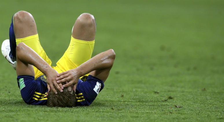 Sweden's Ludwig Augustinsson holds his head as he lies on the pitch at the end of the group F match between Germany and Sweden at the 2018 soccer World Cup in the Fisht Stadium in Sochi, Russia, Saturday, June 23, 2018. Germany won 2-1. Sweden's Ludwig Augustinsson holds his head as he lies on the pitch at the end of the group F match between Germany and Sweden at the 2018 soccer World Cup in the Fisht Stadium in Sochi, Russia, Saturday, June 23, 2018. Germany won 2-1.