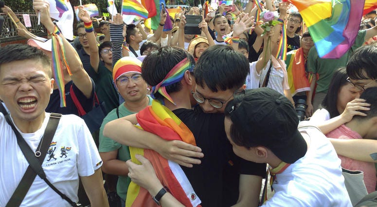 Same-sex marriage supporters hug outside the Legislative Yuan in Taipei, Taiwan, Friday, May 17, 2019, after Taiwan's legislature has passed a law allowing same-sex marriage in a first for Asia. Same-sex marriage supporters hug outside the Legislative Yuan in Taipei, Taiwan, Friday, May 17, 2019, after Taiwan's legislature has passed a law allowing same-sex marriage in a first for Asia.