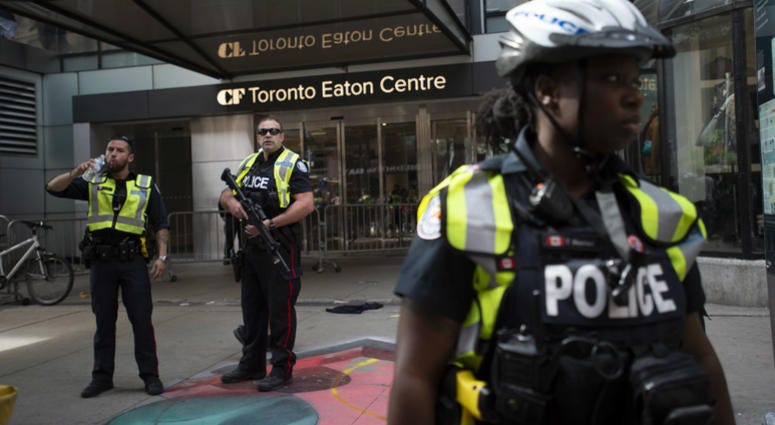 Toronto Police secure the scene where shots were fired during the Toronto Raptors NBA basketball championship parade in Toronto, Monday, June 17, 2019. Toronto Police secure the scene where shots were fired during the Toronto Raptors NBA basketball championship parade in Toronto, Monday, June 17, 2019.