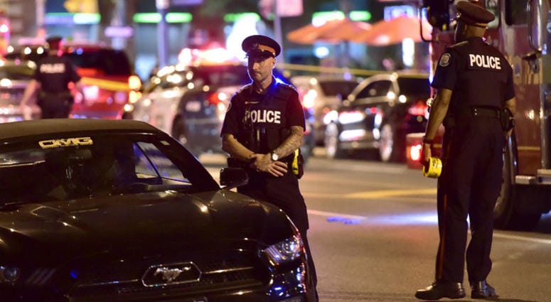 Police work the scene of a shooting in Toronto on Sunday, July 22, 2018. Police work the scene of a shooting in Toronto on Sunday, July 22, 2018.
