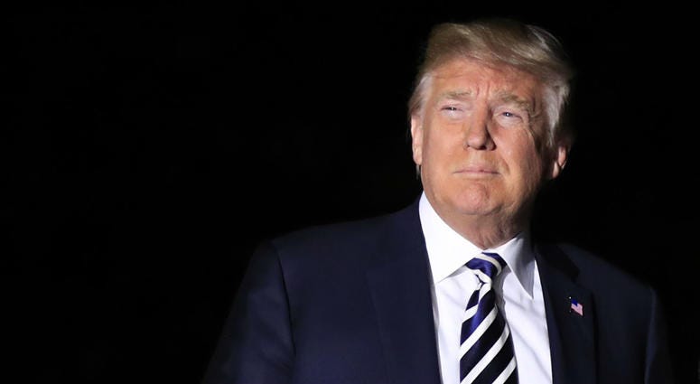 President Donald Trump leaves the White House in Washington with first lady Melania Trump, early Thursday, May 10, 2018, to greet three freed Americans detained in North Korea for over a year, who are arriving at Andrews Air Force Base, Md. President Donald Trump
