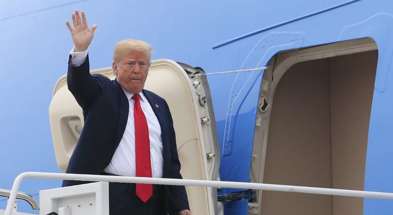 President Donald Trump waves as he boards Air Force One at Andrews Air Force Base, Md., Thursday, May 31, 2018, for a trip to Houston, Texas, to meet the Santa Fe family members and community leaders. President Donald Trump waves as he boards Air Force One