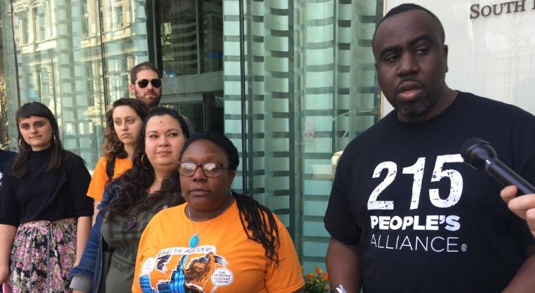 Chenjerai Kumanyika (right) and other activists with 215 People's Alliance say the city's 10-year tax abatement should be eliminated, calling out Councilman Allan Domb, who earned a high net worth in local real estate. 215 People's Alliance