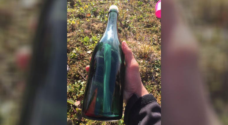 This undated photo provided by Tyler Ivanoff shows a bottle with a message that he found on the shores of western Alaska. Ivanoff found the handwritten Russian letter dated 1969 early this month while gathering firewood. Russian message in a bottle