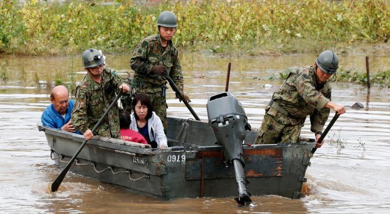 Residents are rescued in Marumori town, Miyagi prefecture, Japan Monday, Oct. 14, 2019 following Typhoon Hagibis. Typhoon Hagibis