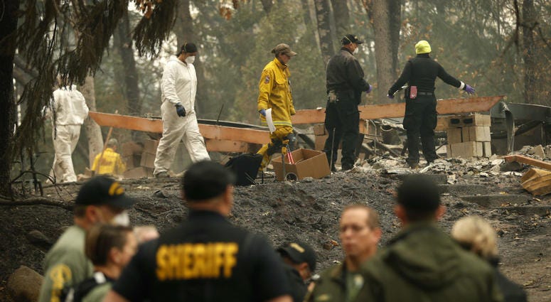 Investigators recover human remains at a home burned in the Camp Fire, Thursday, Nov. 15, 2018, in Magalia, Calif. Investigators recover human remains at a home burned in the Camp Fire, Thursday, Nov. 15, 2018, in Magalia, Calif.
