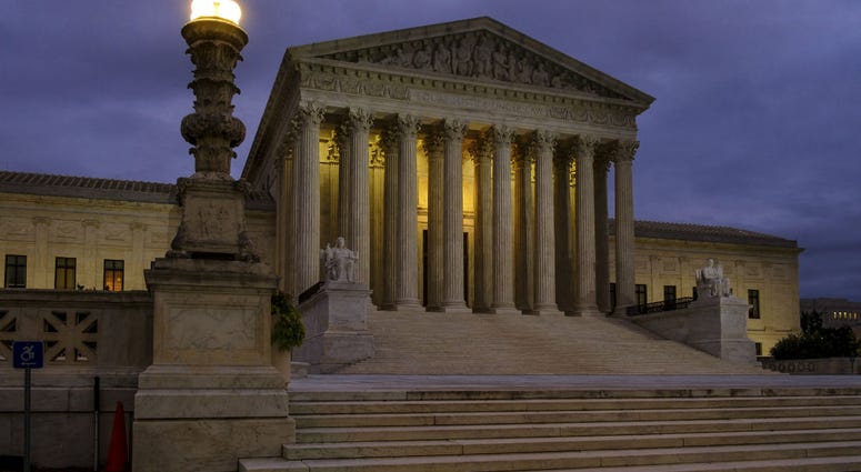 In this Oct. 5, 2018, file photo, the U. S. Supreme Court building stands quietly before dawn in Washington. In this Oct. 5, 2018, file photo, the U. S. Supreme Court building stands quietly before dawn in Washington.