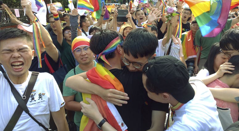 Same-sex marriage supporters hug outside the Legislative Yuan in Taipei, Taiwan, Friday, May 17, 2019, after Taiwan's legislature has passed a law allowing same-sex marriage in a first for Asia. Same-sex marriage supporters hug outside the Legislative Yuan in Taipei, Taiwan, Friday, May 17, 2019, after Taiwan's legislature has passed a law allowing same-sex marriage in a first for Asia.