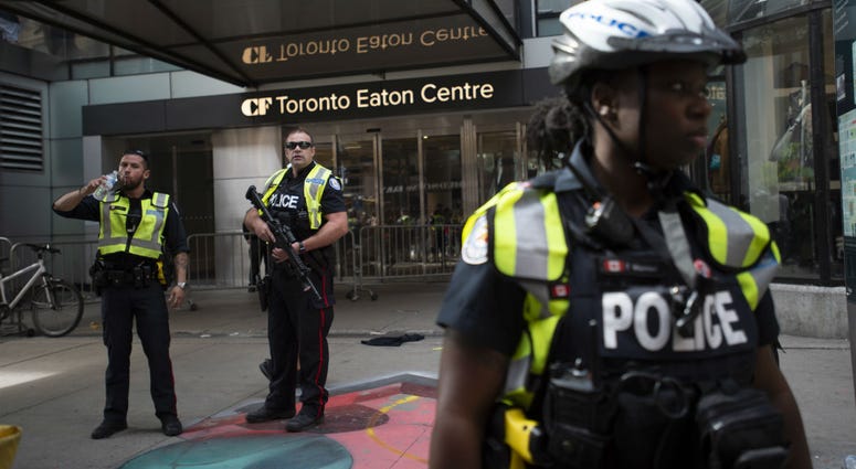 Toronto Police secure the scene where shots were fired during the Toronto Raptors NBA basketball championship parade in Toronto, Monday, June 17, 2019. Toronto Police secure the scene where shots were fired during the Toronto Raptors NBA basketball championship parade in Toronto, Monday, June 17, 2019.