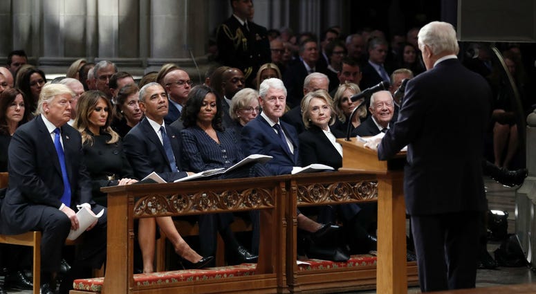From left: Donald Trump, Melania Trump, Barack Obama, Michelle Obama, Bill Clinton, Hillary Clinton and Jimmy Carter listen as former Canadian Prime Minister Brian Mulroney speaks during a state funeral for George H.W. Bush at the National Cathedral. From left: Donald Trump, Melania Trump, Barack Obama, Michelle Obama, Bill Clinton, Hillary Clinton and Jimmy Carter listen as former Canadian Prime Minister Brian Mulroney speaks during a state funeral for George H.W. Bush at the National Cathedral.