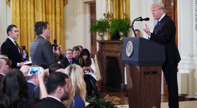 President Donald Trump defended his characterization of the migrant caravan as an "invasion" before attacking CNN's Jim Acosta, calling him a "rude, terrible person." Trump clashes with Acosta in testy exchange