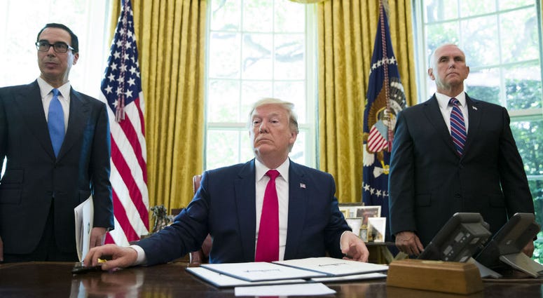 President Donald Trump listens to a reporter's question after signing an executive order to increase sanctions on Iran, in the Oval Office of the White House, Monday, June 24, 2019, in Washington. President Donald Trump listens to a reporter's question after signing an executive order to increase sanctions on Iran, in the Oval Office of the White House, Monday, June 24, 2019, in Washington.