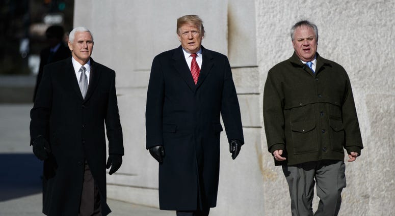 President Donald Trump, center, Vice President Mike Pence, left, escorted by Acting Interior Secretary David Bernhardt, right, visit the Martin Luther King Jr. Memorial, Monday, Jan. 21, 2019, in Washington. President Donald Trump, center, Vice President Mike Pence, left, escorted by Acting Interior Secretary David Bernhardt, right, visit the Martin Luther King Jr. Memorial, Monday, Jan. 21, 2019, in Washington.