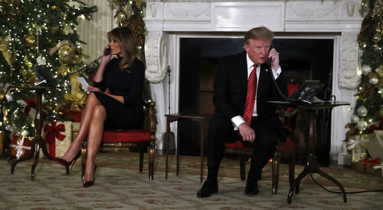 President Donald Trump and first lady Melania Trump each speak on the phone sharing updates to track Santa's movements from the North American Aerospace Defense Command (NORAD) Santa Tracker on Christmas Eve, Monday, Dec. 24, 2018. President Donald Trump and first lady Melania Trump each speak on the phone sharing updates to track Santa's movements from the North American Aerospace Defense Command (NORAD) Santa Tracker on Christmas Eve, Monday, Dec. 24, 2018.