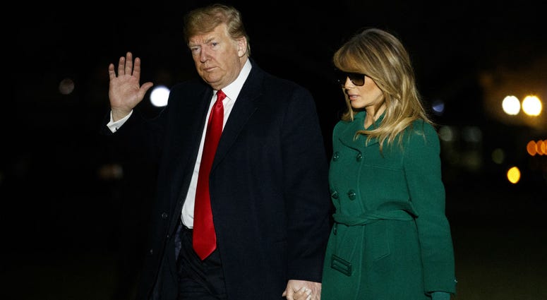President Donald Trump and first lady Melania Trump arrive on the South Lawn of the White House after making a surprise visit to troops in Iraq, Thursday, Dec. 27, 2018, in Washington. President Donald Trump and first lady Melania Trump arrive on the South Lawn of the White House after making a surprise visit to troops in Iraq, Thursday, Dec. 27, 2018, in Washington.