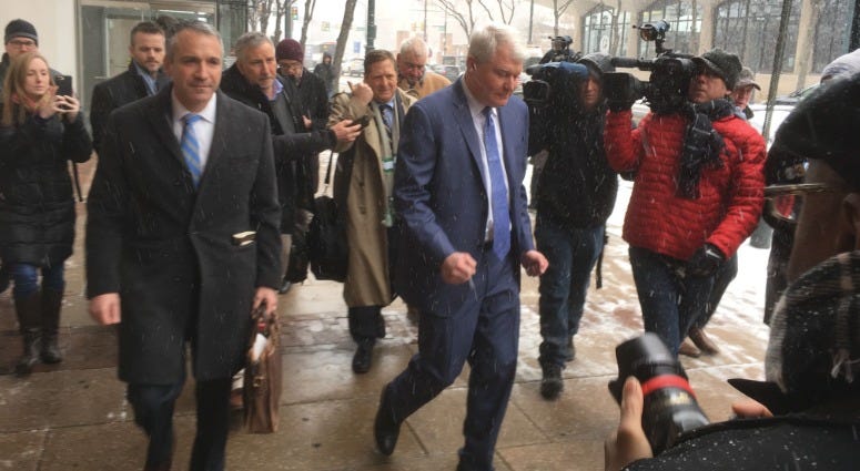 John Dougherty (center) leaves his first court appearance following the public corruption indictment against him, Feb. 1, 2019. John Dougherty (center) leaves his first court appearance.